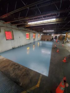 Chemical-resistant industrial flooring protecting facility concrete