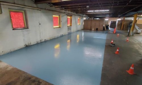 Chemical-resistant industrial flooring protecting facility concrete